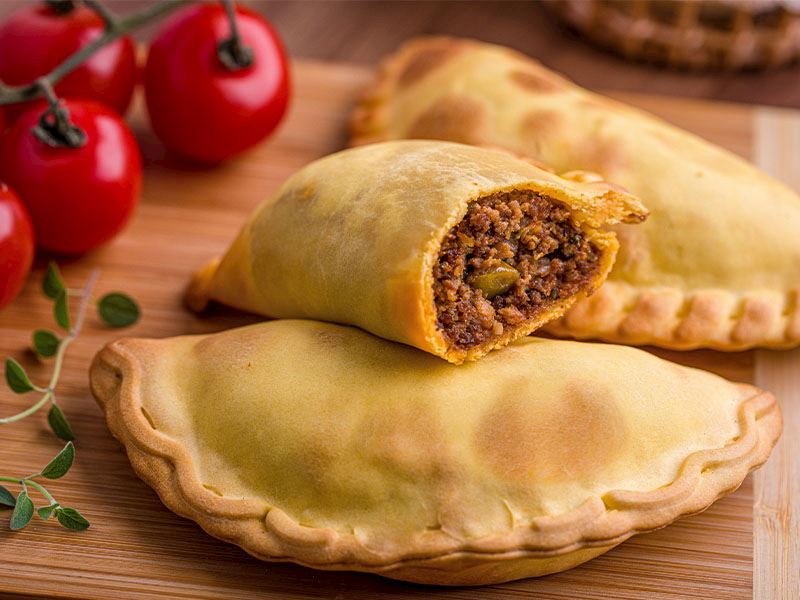 Empanada: Latin Amerika Mutfağının Lezzetli İkonu Empanada, Latin Amerika mutfağının