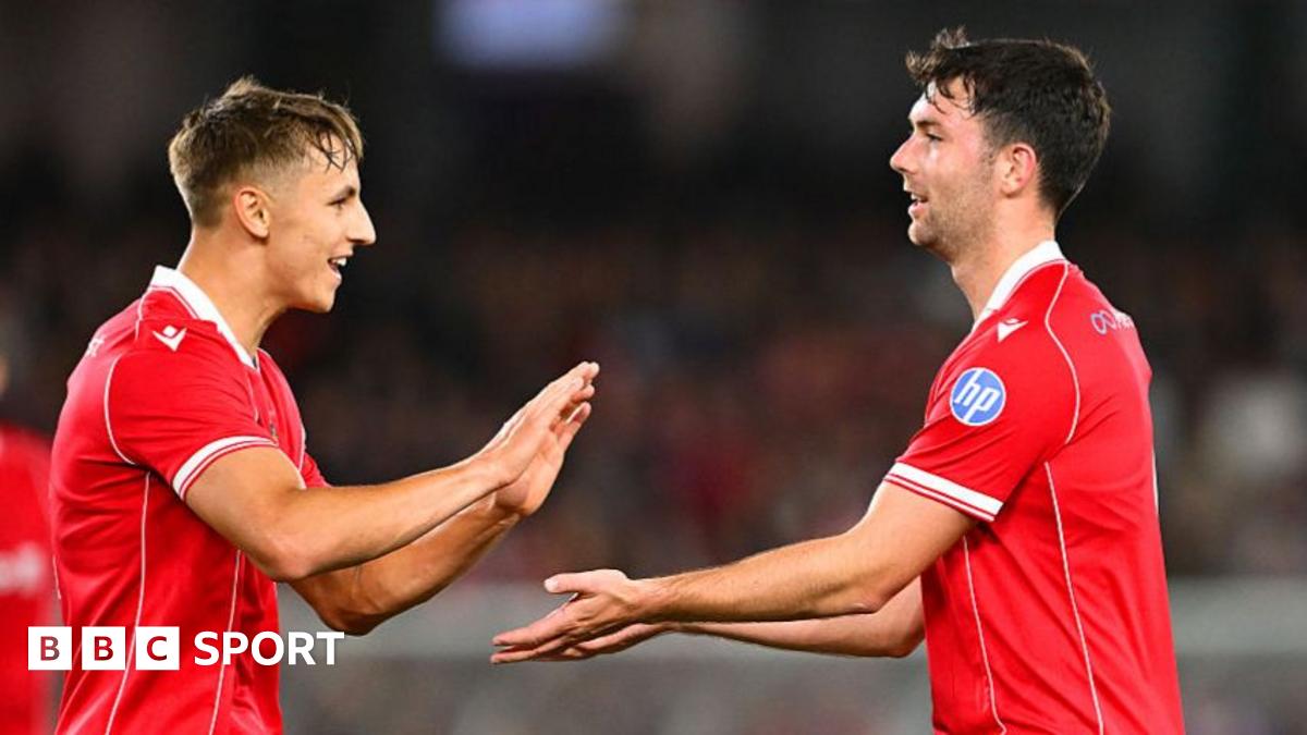 Max Cleworth celebrates with Wrexham team-mate Tom O'Connor